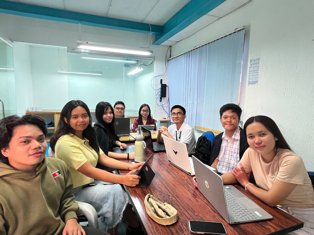 The Pentascale founding team working together around a table